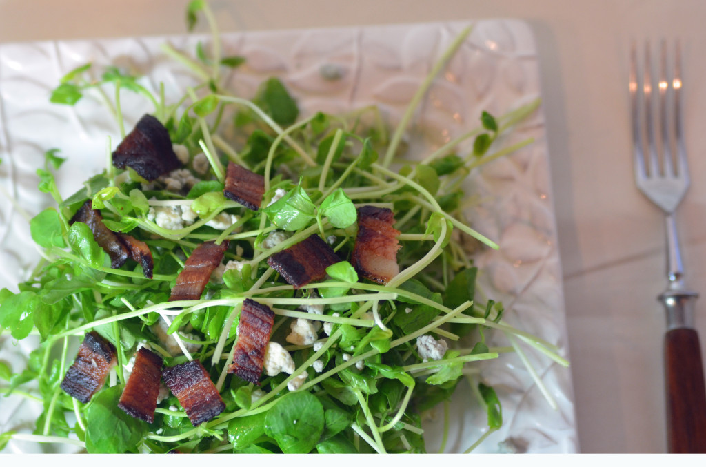 Peas shoot salad with fork